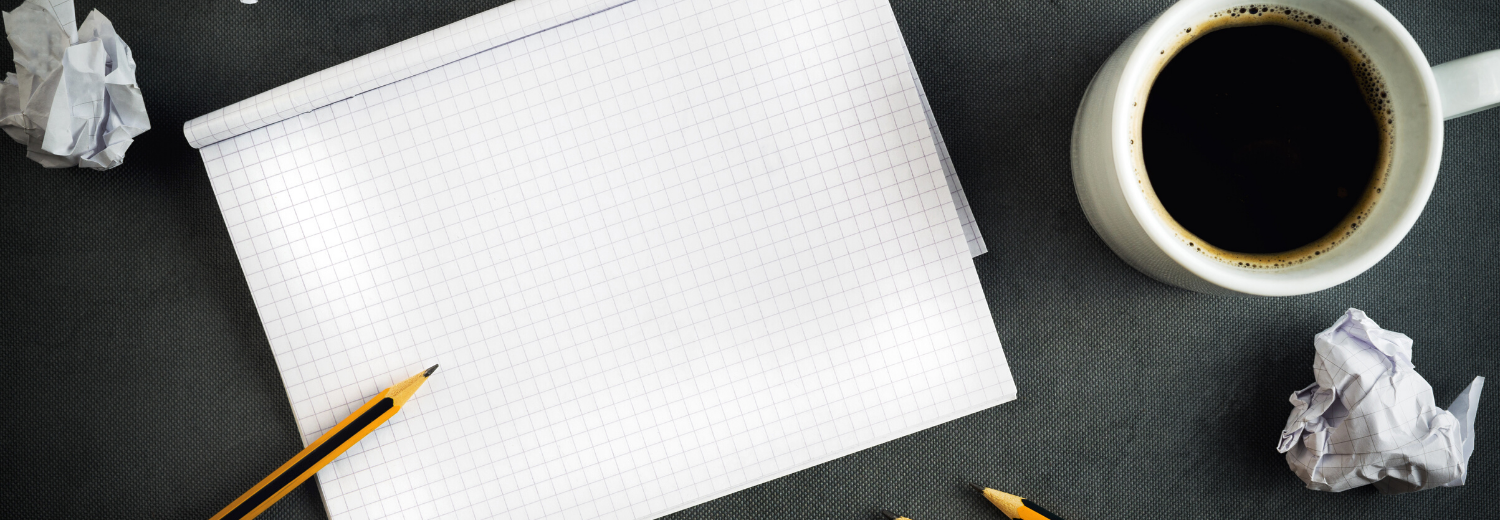 Blog header empty pad on desk, pen and coffee cup